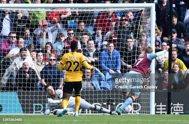 Matej Vydra of Burnley scores their team's first goal past Jose Sa of Wolverhampton Wanderers during the Premier League match between Burnley and...