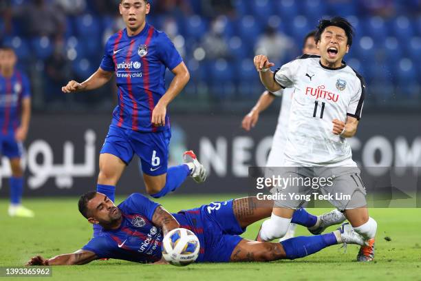 Yu Kobayashi of Kawasaki Frontale is fouled on a tackle by Mauricio dos Santos Nascimento of Johor Darul Ta'zim during the first half of the AFC...