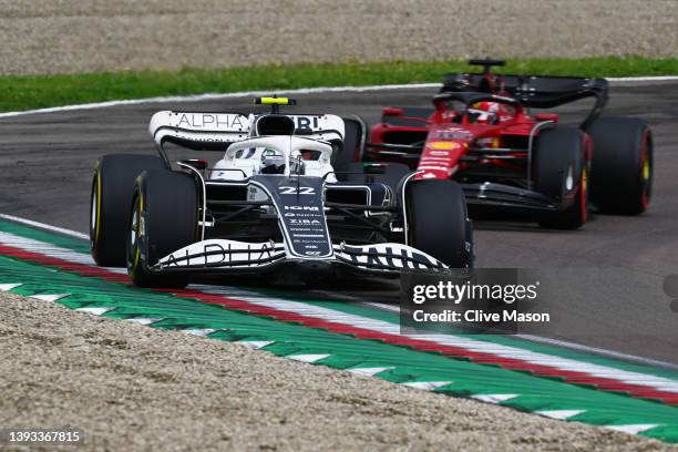 Yuki Tsunoda of Japan driving the Scuderia AlphaTauri AT03 leads Charles Leclerc of Monaco driving the Ferrari F1-75 during the F1 Grand Prix of...