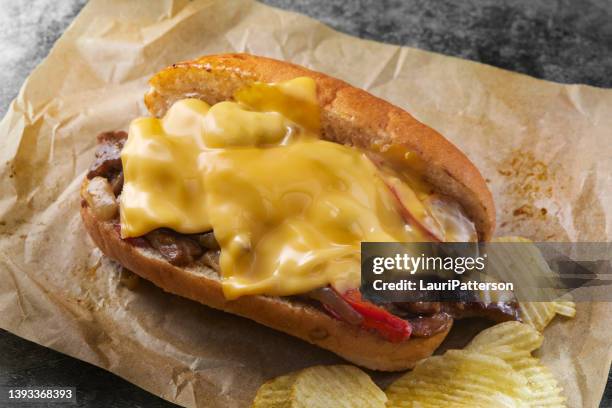 philly cheese steak sandwich - steak sandwich and chips stock pictures, royalty-free photos & images