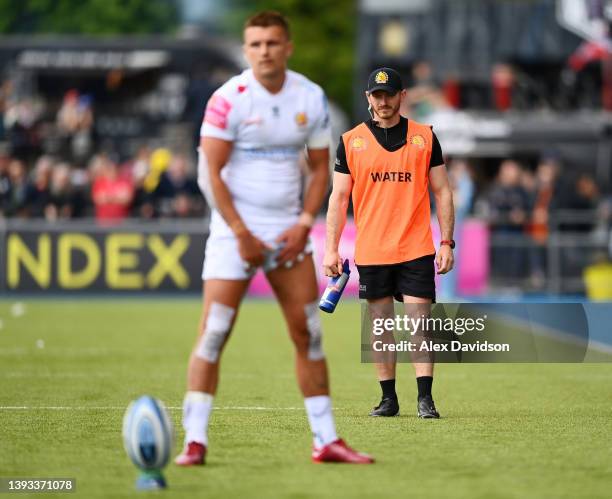 Exeter Chiefs Assistant Coach, Gareth Steenson watches on as Henry Slade takes a kick during the Gallagher Premiership Rugby match between Saracens...