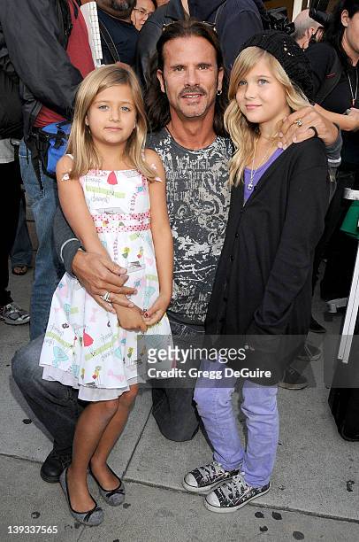 Lorenzo Lamas, daughters Isabella Lamas and Victoria Lamas arrive at the Grand Opening of Famous Cupcakes on October 7, 2009 in Beverly Hills,...