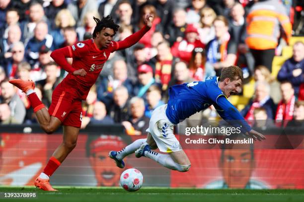 Anthony Gordon of Everton is challenged by Trent Alexander-Arnold of Liverpool during the Premier League match between Liverpool and Everton at...