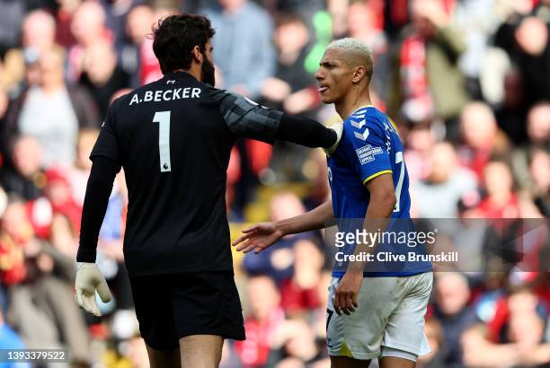 Alisson Becker of Liverpool confronts Richarlison of Everton during the Premier League match between Liverpool and Everton at Anfield on April 24,...