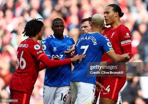 Richarlison of Everton clashes with Virgil van Dijk of Liverpool during the Premier League match between Liverpool and Everton at Anfield on April...