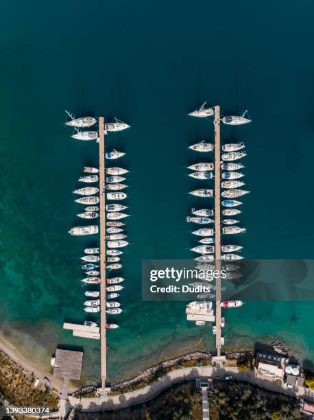 drone view sailboats in the marina - marina stockfoto's en -beelden