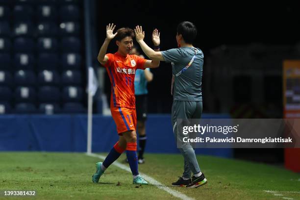 Liu Guobao of Shandong Taishan celebrates scoring his side's second goal with head coach Head coach Yu Yuanwei during the AFC Champions League Group...