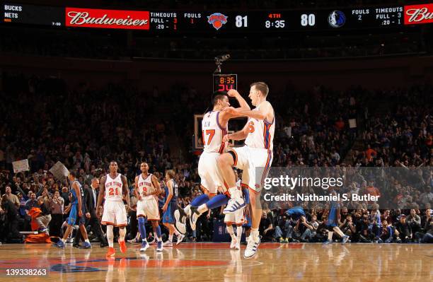 Jeremy Lin and Steve Novak of the New York Knicks react to the game action against the Dallas Mavericks on February 19, 2012 at Madison Square Garden...
