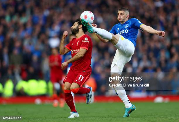Vitaliy Mykolenko of Everton battles for possession with Mohamed Salah of Liverpool during the Premier League match between Liverpool and Everton at...