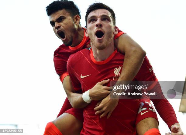 Andy Robertson of Liverpool celebrates after scoring the first goal during the Premier League match between Liverpool and Everton at Anfield on April...