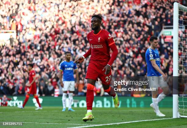 Divock Origi of Liverpool celebrates after scoring their team's second goal during the Premier League match between Liverpool and Everton at Anfield...