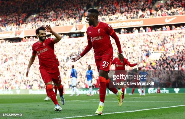 Divock Origi celebrates eith Mohamed Salah of Liverpool after scoring their team's second goal during the Premier League match between Liverpool and...