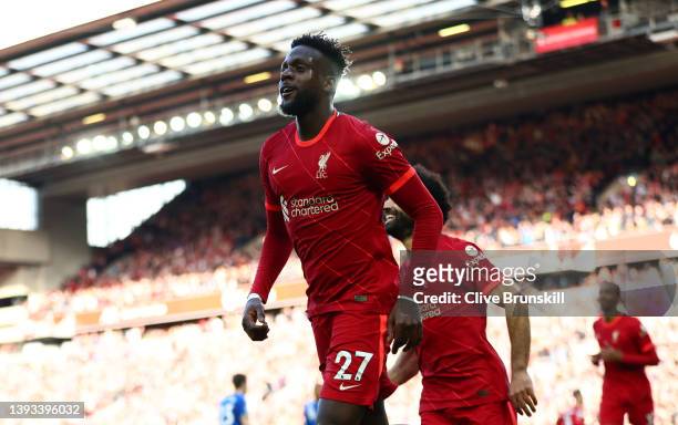 Divock Origi celebrates with Mohamed Salah of Liverpool after scoring their team's second goal during the Premier League match between Liverpool and...