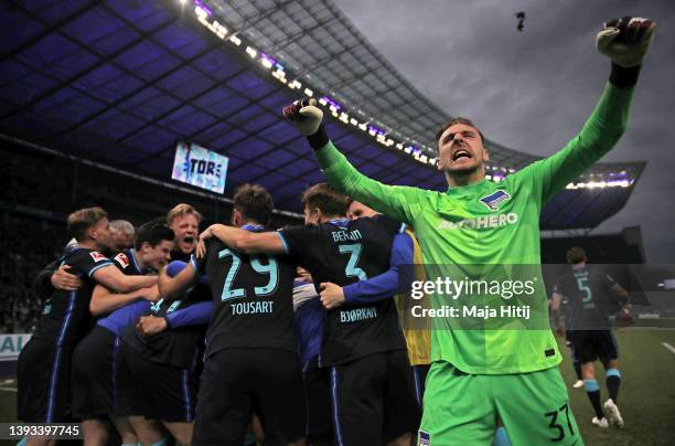 Marcel Lotka joins players of Hertha Berlin as they celebrate their side's win after the final whistle of the Bundesliga match between Hertha BSC and...
