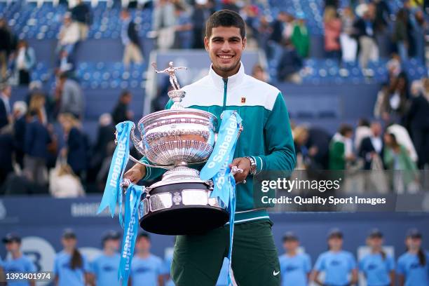 Carlos Alcaraz of Spain celebrates with the winners trophy after defeating Pablo Carreno of Spain in the final during day seven of the Barcelona Open...