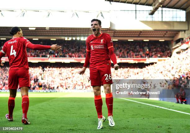 Andy Robertson of Liverpool celebrates after scoring the opening goal during the Premier League match between Liverpool and Everton at Anfield on...