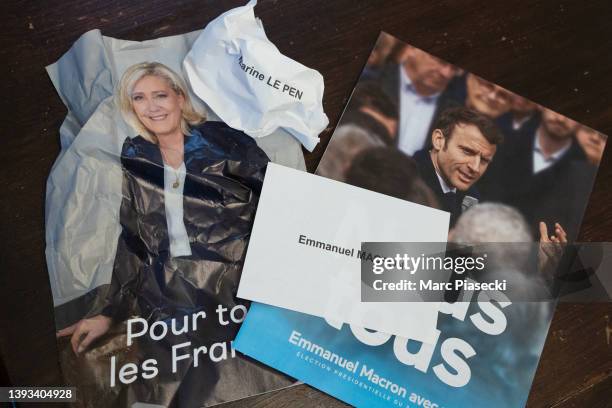 Photo illustration shows ballots and program leaflets of the two candidates of the French Presidential elections on April 24, 2022. Emmanuel Macron...