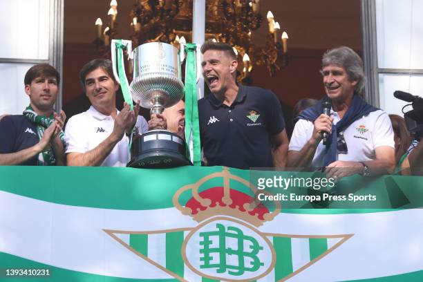 Manuel Pellegrini, head coach of Real Betis, and Joaquin Sanchez of Real Betis shows the trophy during the celebration of Real Betis Balompie as...