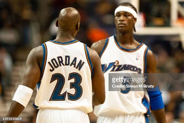Michael Jordan and Kwame Brown of the Washington Wizards during a game against the Cleveland Cavaliers at The MCI Center on November 06, 2002 in...