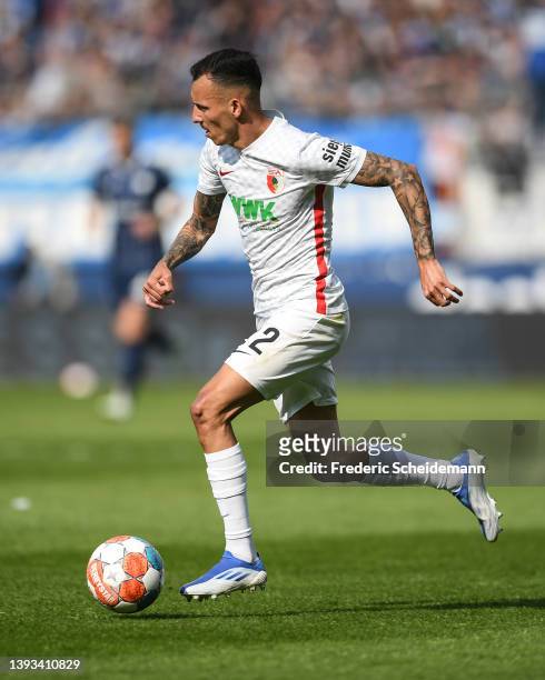 Iago of Augsburg controls the ball during the Bundesliga match between VfL Bochum and FC Augsburg at Vonovia Ruhrstadion on April 24, 2022 in Bochum,...