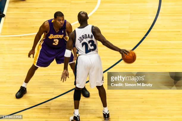 Michael Jordan of the Washington Wizards and Devean George of the L.A.Lakers in action during a game at The MCI Center on November 08, 2002 in...