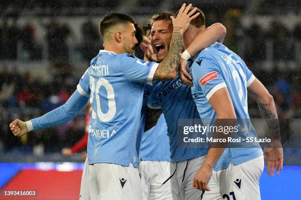 Ciro Immobile of SS Lazio celebrates a opening goal with his team mates during the Serie A match between SS Lazio and AC Milan at Stadio Olimpico on...