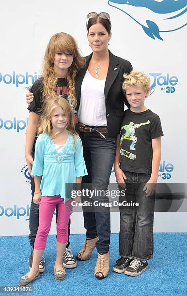 Marcia Gay Harden, daughter Eulala Scheel, twins Julitta Scheel and Hudson Scheel arrive at the World Premiere of "Dolphin Tale" at the Village...