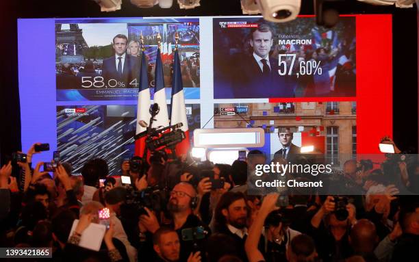 The face of Emmanuel Macron, French presidential election candidate for ‘La Republique en Marche’ political movement appears on a giant screen after...