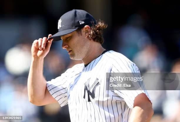 Gerrit Cole of the New York Yankees acknowledges the fans as he heads back to the dugout after he is pulled from the game in the seventh inning...