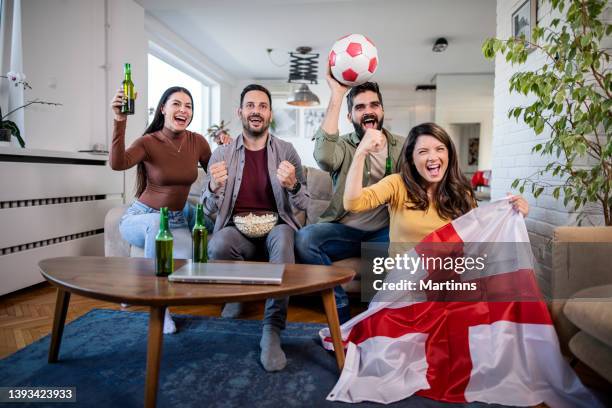 english fans are watching a football  match on tv - england football stock pictures, royalty-free photos & images