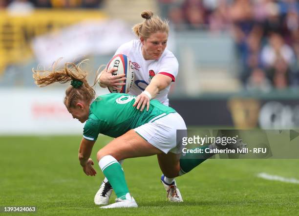 Lydia Thompson of England is tackled by Kathryn Dane of Ireland during the TikTok Women's Six Nations match between England and Ireland at Mattioli...