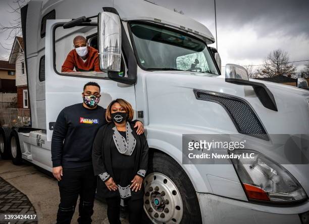 Elizabeth Wellington and her husband Antonio, in truck, with son Stephen on January 16 2021. The couple own Wellie the Transporter LLC in Elmont, New...