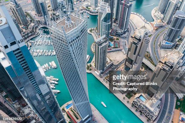 aerial view of dubai marina futuristic skyline with man made lake in the middle - dubai skyscraper stock pictures, royalty-free photos & images