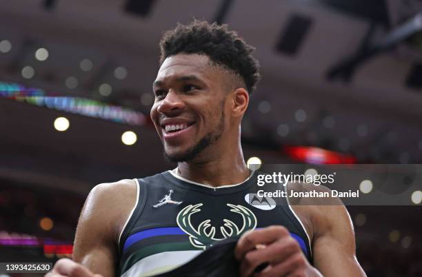 Giannis Antetokounmpo of the Milwaukee Bucks smiles at fans near the end of Game Four of the Eastern Conference First Round Playoffs against the...