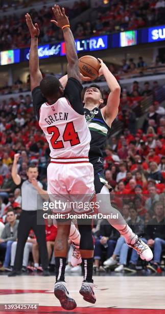 Grayson Allen of the Milwaukee Bucks is fouled while shooting by Javonte Green of the Chicago Bulls during Game Four of the Eastern Conference First...