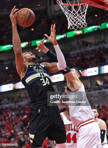 Giannis Antetokounmpo of the Milwaukee Bucks shoots over Nikola Vucevic of the Chicago Bulls during Game Four of the Eastern Conference First Round...