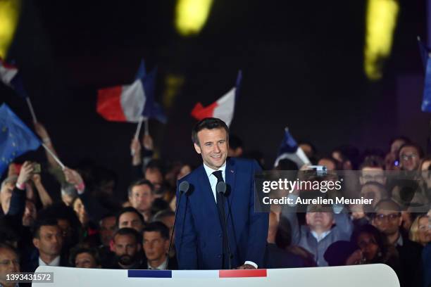 France's centrist incumbent president Emmanuel Macron adresses voters in front of the Eiffel Tower after beating his far-right rival Marine Le Pen...