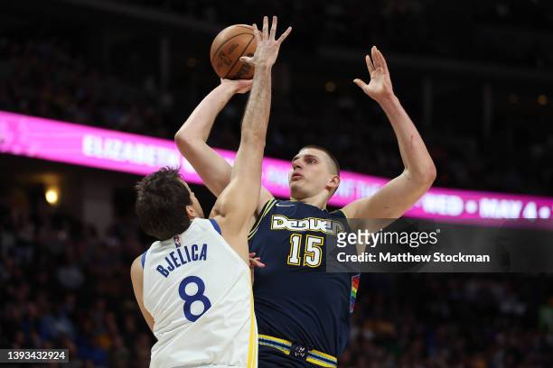 Nikola Jokic of the Denver Nuggets puts yp a shot over Nemanja Bjelica of the Golden State Warriors in the first quarter during Game Four of the...
