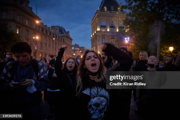 Parisians protest and chant against the election of France's centrist incumbent president Emmanuel Macron for a second five-year term as president at...