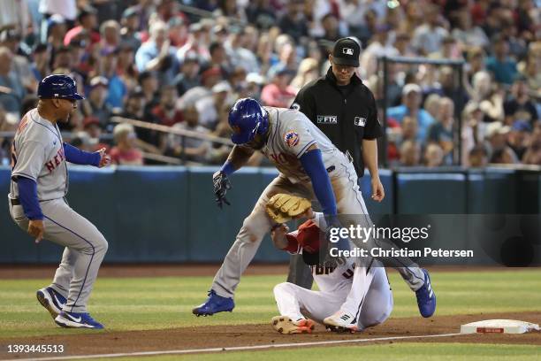 Starling Marte of the New York Mets collides with infielder Sergio Alcantara of the Arizona Diamondbacks during the sixth inning of the MLB game at...