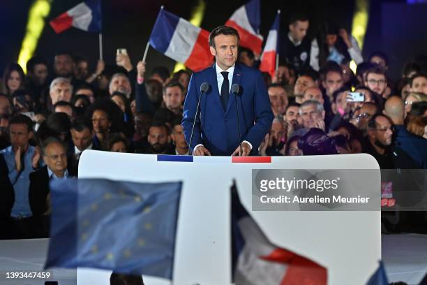 France's centrist incumbent president Emmanuel Macron adresses voters in front of the Eiffel Tower after beating his far-right rival Marine Le Pen...