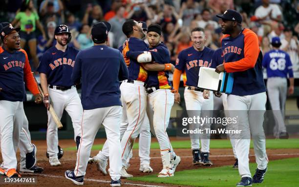 Jeremy Pena of the Houston Astros is congratulated by teammates after hitting a walk-off two-run home run in the tenth inning against the Toronto...