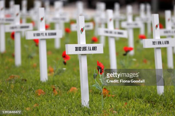 People gather asNew Zealand Prime Minister Jacinda Ardern speaks at Mt Albert War memorial hall to commemorate Anzac Day on April 25, 2022 in...