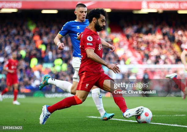 Mohamed Salah of Liverpool runs with the ball during the Premier League match between Liverpool and Everton at Anfield on April 24, 2022 in...