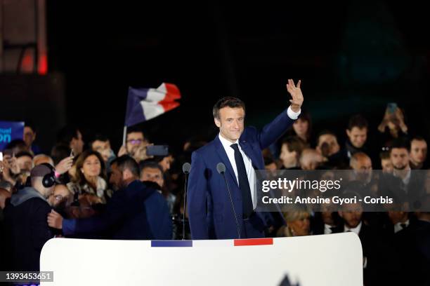 France's centrist incumbent president Emmanuel Macron addresses voters in front of the Eiffel Tower after beating his far-right rival Marine Le Pen...