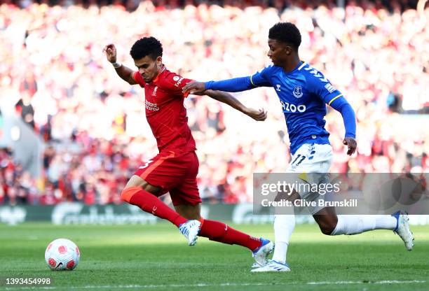 Luis Diaz of Liverpool battles for the ball with Demarai Gray of Everton during the Premier League match between Liverpool and Everton at Anfield on...