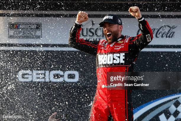 Ross Chastain, driver of the Moose Fraternity Chevrolet, celebrates in victory lane after winning the NASCAR Cup Series GEICO 500 at Talladega...
