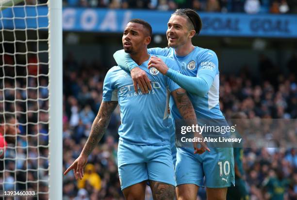 Gabriel Jesus celebrates with Jack Grealish of Manchester City after scoring their team's second goal during the Premier League match between...