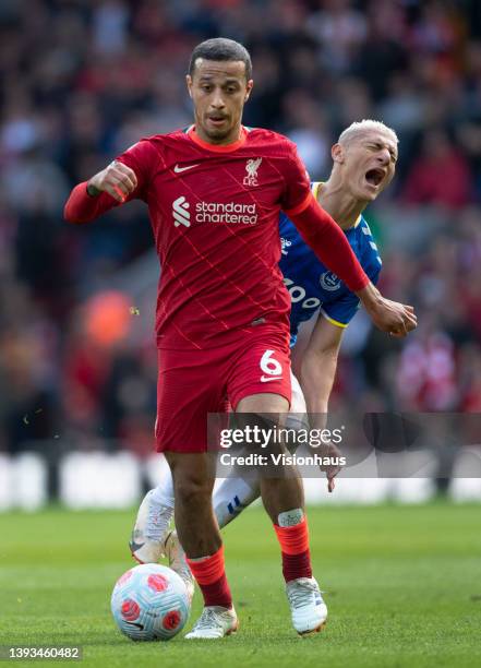 Thiago of Liverpool and Richarlison of Everton in action during the Premier League match between Liverpool and Everton at Anfield on April 24, 2022...