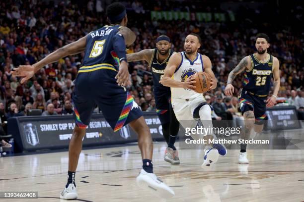 Stephen Curry of the Golden State Warriors drives against the Denver Nuggets in the fourth quarter during Game Four of the Western Conference First...